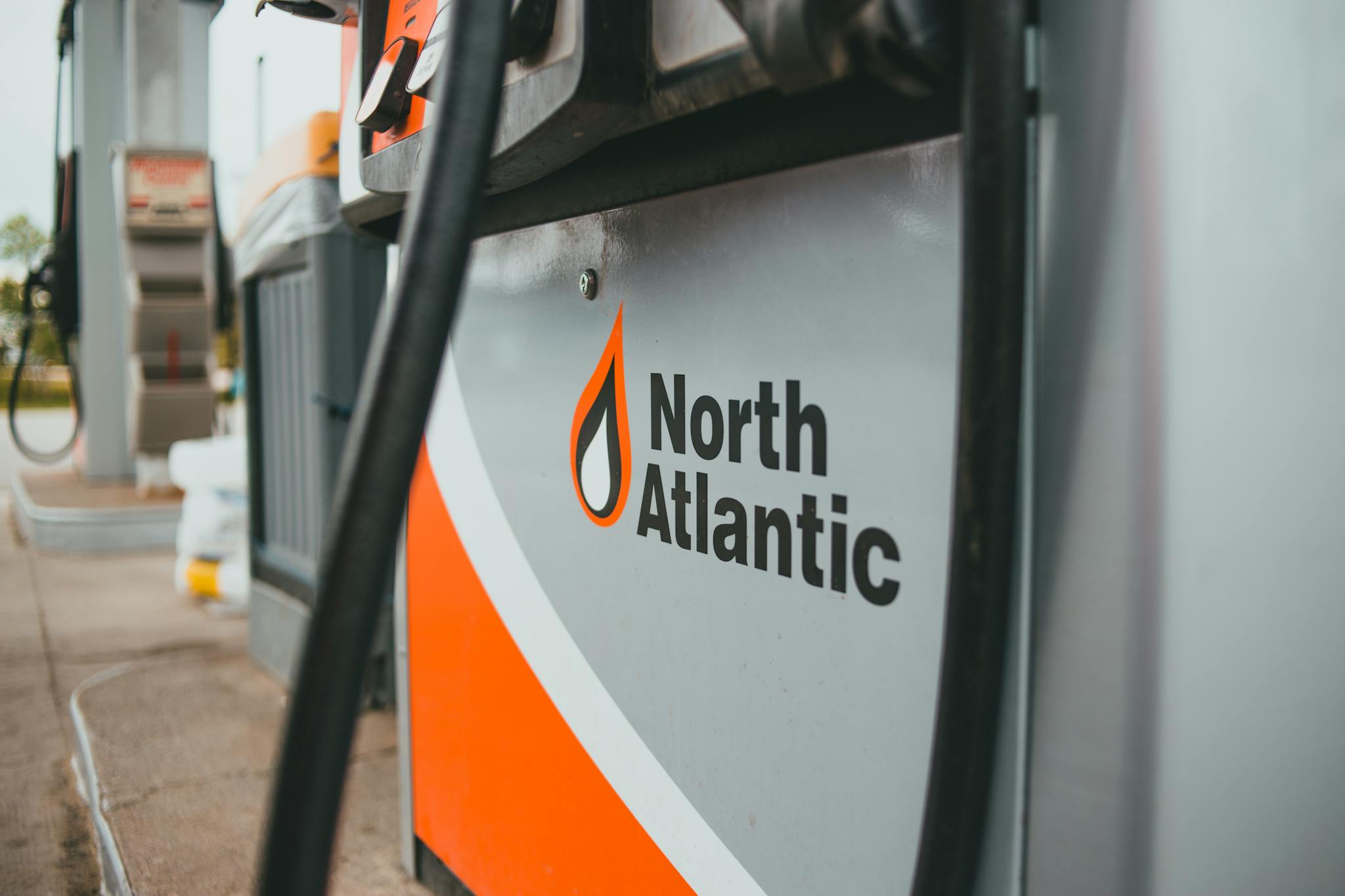 Detailed view of North Atlantic fuel dispenser at an outdoor gas station.